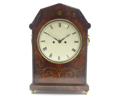 Regency figured mahogany bracket clock, canted top with scroll and leaf carved mounts to each corner, circular Roman painted 