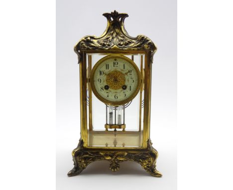 Late 19th century Art Nouveau style gilt metal mantel clock, moulded draped foliate pediment above circular enamel Arabic dia