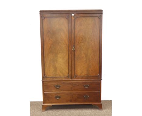 Waring & Gillow Ltd - Georgian style mahogany Gentleman's wardrobe press, two figured doors enclosing 'John Watts, Sheffield 