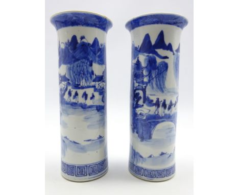 Pair of 19th century Chinese blue and white cylindrical vases decorated with figures and pagodas in a mountainous landscape w