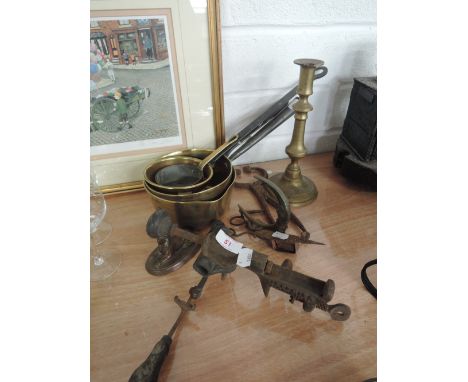 A selection of brass and metal ware including pans, candlestick, man in the moon, Sphinx and cartridge filler by Jeffries of 
