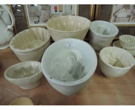 Six ceramic jelly moulds