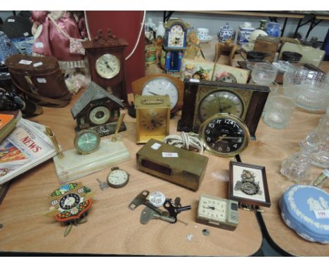 A collection of mantel clocks including early digital