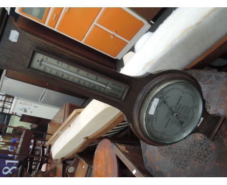An early 20th Century barometer, 'Wilsn' , retailed by Leightons of Lancaster , bearing presentation plaque for Bro. J W Hodg
