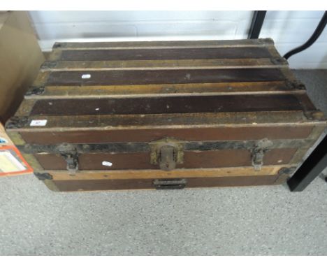 A vintage wooden, metal bound travel trunk