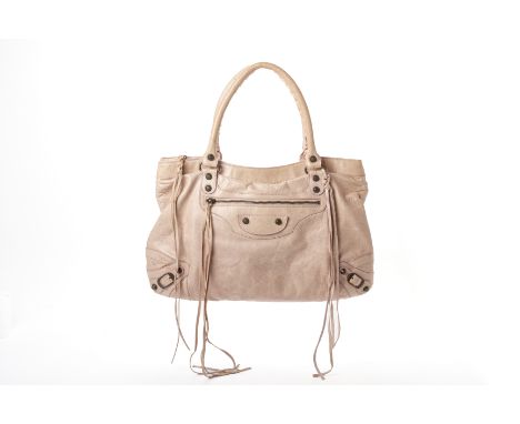 A BALENCIAGA 'CLASSIC CITY' BEIGE LEATHER HANDBAG
The design featuring a distressed beige and textured leather finish, with a