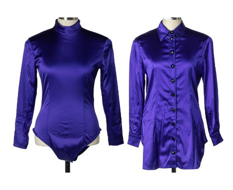 A EMANUEL UNAGRO PURPLE/BLUE BLOUSE AND A BODY SUIT
The blouse with a high neck black buttoned design and buttoned sleeves; t