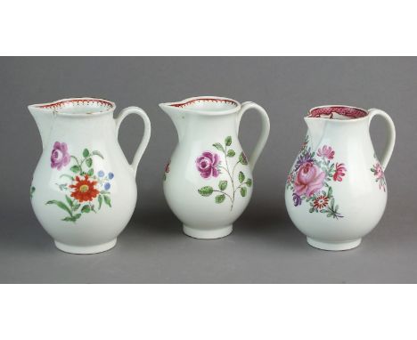 Three Caughley porcelain polychrome sparrow beak cream jugs, circa 1785-90, unmarked, the tallest 10cm high (3)