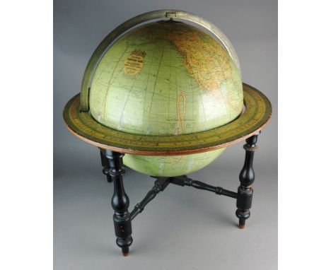 A W & AK Johnston 18 inch terrestrial globe mounted in an ebonised four leg frame, joined by a cross stretcher and with zodia