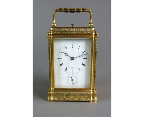 A French gilt brass gorge cased repeating carriage alarm clock by Le Roy et Fils with five bevelled glass panels and platform