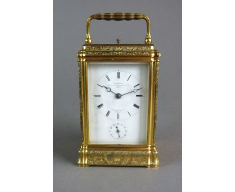 A French gilt brass gorge cased repeating carriage alarm clock by Le Roy et Fils with five bevelled glass panels and platform