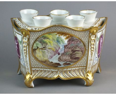 An English porcelain bough pot and cover, circa 1810, of typical D-form painted with a central waterfall landscape panel betw