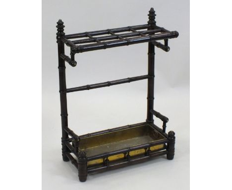 An Edwardian simulated bamboo framed stick stand with brass liner, 36cm wide, 23cm deep, 65cm high