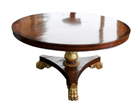 A George IV mahogany and rosewood crossbanded centre table, second quarter 19th century, the circular tilt top raised on ring