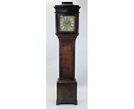 A George III oak cottage longcase clock, the pagoda top square hood enclosing a twelve inch square dial with silvered chapter