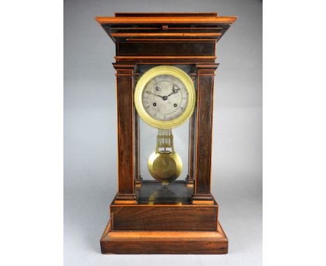 An early 19th century French portico style rosewood and satinwood cased mantel clock the stepped detachable cresting enclosin