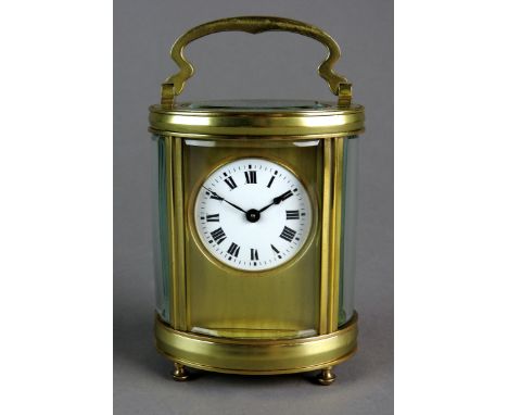 A French oval brass cased carriage timepiece with five glass case and platform lever escapement, 5cm white enamel dial with R