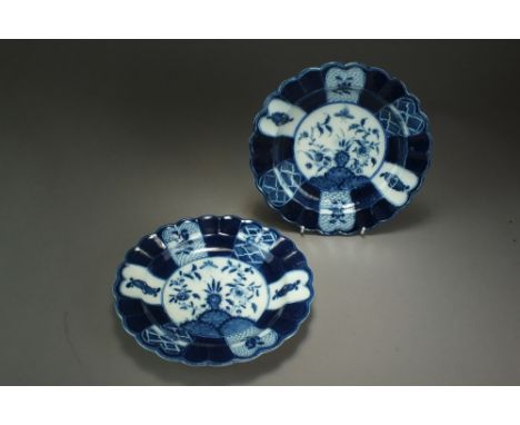 A pair of Caughley powder blue fluted plates painted with the Flaming or Holed Rock design, circa 1780, impressed Salopian ma