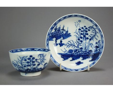 A Caughley porcelain tea bowl and saucer, circa 1785, painted with the Rock Strata Island pattern within a cross-hatch border