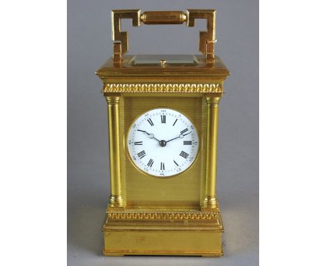 A gilt brass repeating carriage clock with bevelled five panel glass case and platform lever escapement, the 5.5cm white enam
