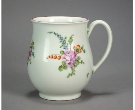 A Worcester porcelain mug painted with polychrome flowers below a puce-lined rim, circa 1775, 9cm high     General wear, very