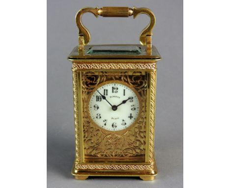 A French brass cased carriage timepiece the five glass case with platform lever escapement and 4.5cm diameter white enamel di