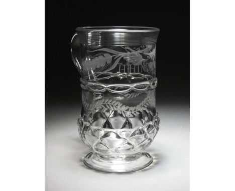 An early 19th century glass cylindrical porter mug, engraved with trailing vine leaves and 'H. Hinde', with a banded upper li