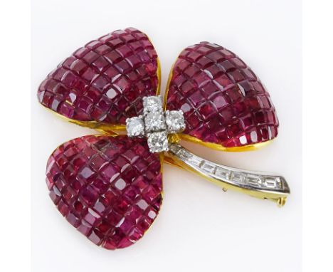 Approx. 32.50 Carat Invisible Set Square Cut Ruby, .58 Carat Diamond and 18 Karat Yellow Gold Flower Brooch. Rubies with vivi