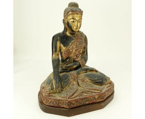 Vintage Gilt Indo-Chinese Carved Jeweled Polychrome Seated Buddha. Shakyamuni style buddha inlaid with mirrored emerald and r