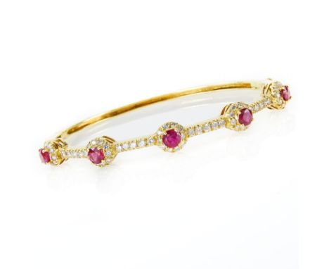 Approx. 1.56 Carat Round Cut Ruby, 1.43 Carat Round Brilliant Cut Diamond and 18 Karat Yellow Gold Bangle Bracelet. Rubies wi