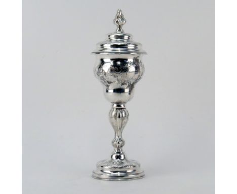 Antique Silver Judaica Repoussé Standing Cup with Cover. Executed with flower and foliage scroll décor, foliage form finial a