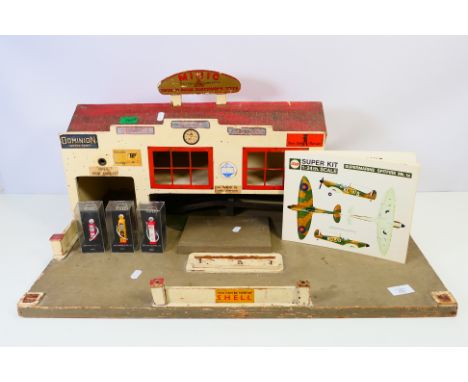 MINIC - AIRFIX - a wooden Minic garage with detachable roof, advertising signs and accessories including ramp and lift. The g