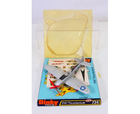 Dinky - A boxed P47 Thunderbolt # 734. The model appears in Very Good condition with light signs of age and use. The plinth i