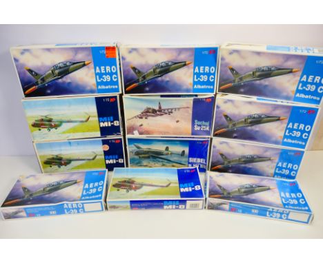 KP - 12 boxed vintage 1:72 scale plastic military aircraft model kits. Lot includes KP #15 Aero L-39C; KP#27 Suchoj Su-25K; K