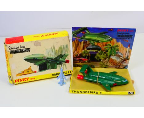 Dinky - Thunderbirds - A boxed Thunderbird 2 & 4 set # 101. The model shows some signs of age and use with some wear. All 4 x