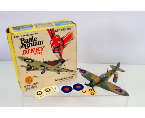 Dinky - A boxed Battle Of Britain Spitfire MkII with motor driven propeller. The model appears in Good condition with some si