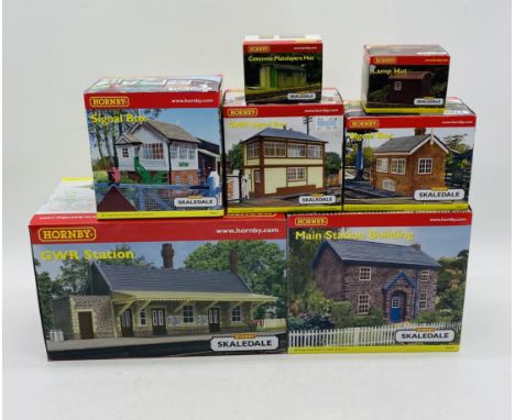 A collection of seven boxed Hornby Skaledale OO gauge railway buildings including GWR Station (R9666), Main Station Building 