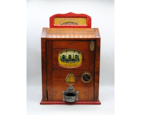 A Brenners 'Roll Out The Barrel' mahogany cased three drum penny slot machine, with key - untested - length46cm, depth 26.5cm