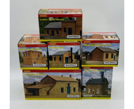A collection of six boxed Hornby Skaledale OO gauge buildings including Winding Engine House (R8777), Compressor House (R8779