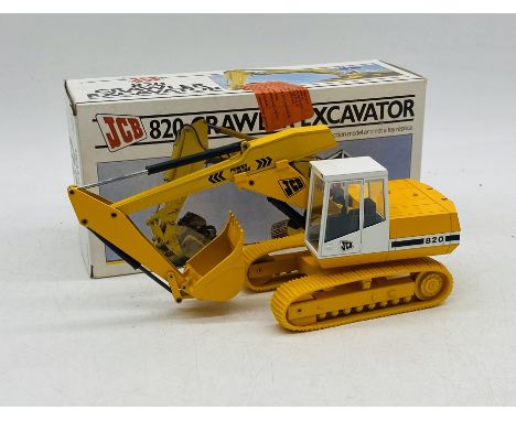 A boxed NZG Models 820 JCB Crawler Excavator die-cast model (1:35 scale - Model No 246)