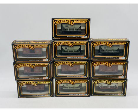 A collection of ten Mainline Railways OO gauge rolling stock wagons including ventilated vans, hopper wagons, Esso Tank Wagon