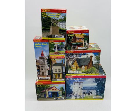 A collection of eight boxed Hornby Skaledale OO gauge buildings including St Michaels Church (R8502), Jubilee Clock Tower (R8