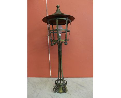 An Arts and Crafts brass lamp