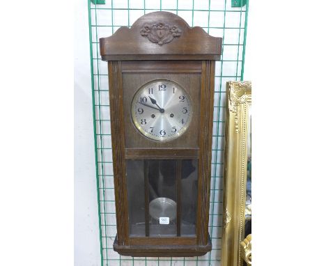 An oak wall clock