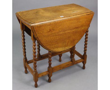 A 1930’s oak small oval gate-leg table on barley-twist legs &amp; turned feet with plain stretchers, 29½” wide x 28” high.