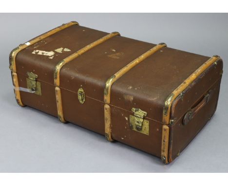 A mid-20th century fibre-covered ribbed travelling trunk fitted with a removable tray enclosed by a hinged lift-lid, &amp; wi