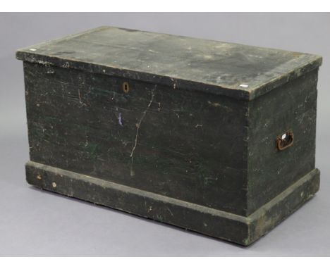 An early/mid-20th century black painted deal travelling trunk with a hinged lift-lid, &amp; with wrought-iron side handles, 3