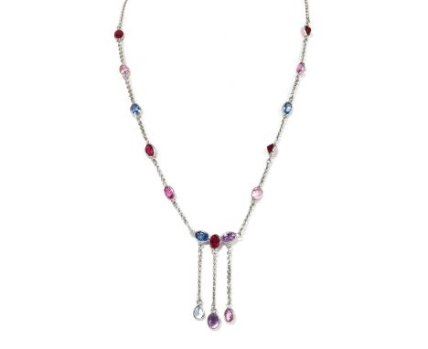 A silver assorted gemstone necklace, with oval and pear mixed cut amethysts, synthetic rubies and pink sapphires, and synthet