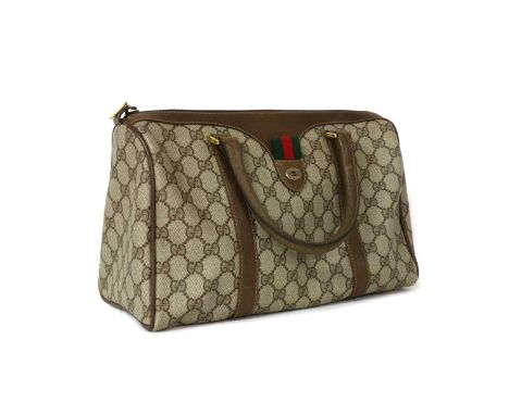 A Gucci Accessory Collection brown canvas and leather Boston bag, traditional monogrammed canvas, leather detailing and dual 