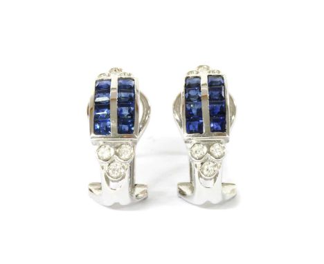 A pair of white gold sapphire and diamond half hoop earrings, with two rows of square step cut sapphires, channel set, with a